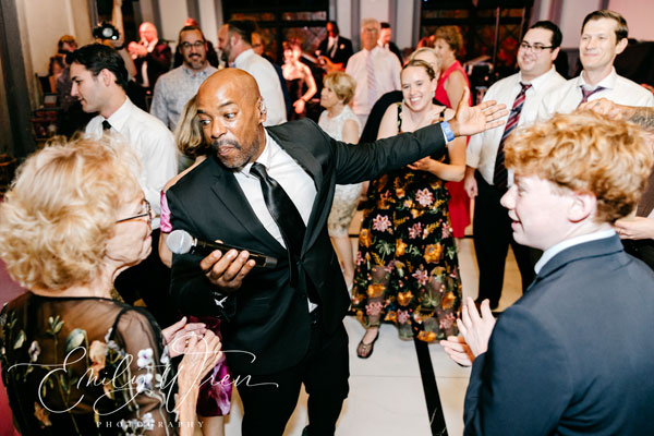 Sid Miller Dance Band performs live, interacting on the dance floor with wedding guests